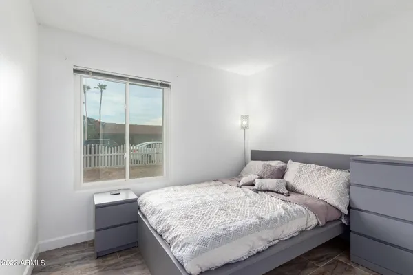 a bedroom with a bed and window