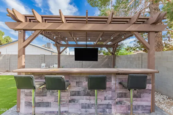 a view of an outdoor space with a table and chairs