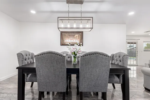 a dining room with furniture and window