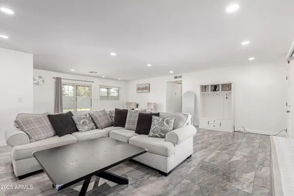a living room with furniture and a couch