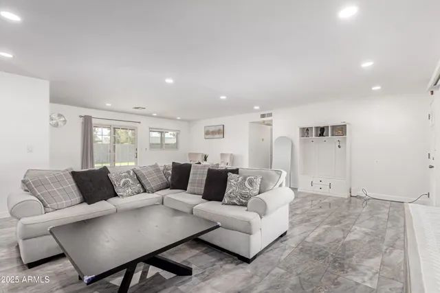 a living room with furniture and a couch
