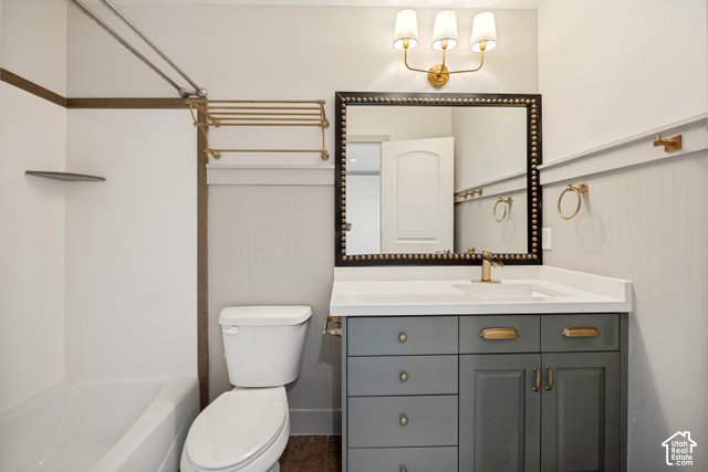 259 Twin River Loop Alpine, UT 84004 - Photo 24 of 61 The ensuite bathroom just off the previous bedroom with tub & shower, countertop space, a single vanity with dual-tone cabinetry and gold-tone hardware, rectangular undermount sink, and wall-mounted light fixture.