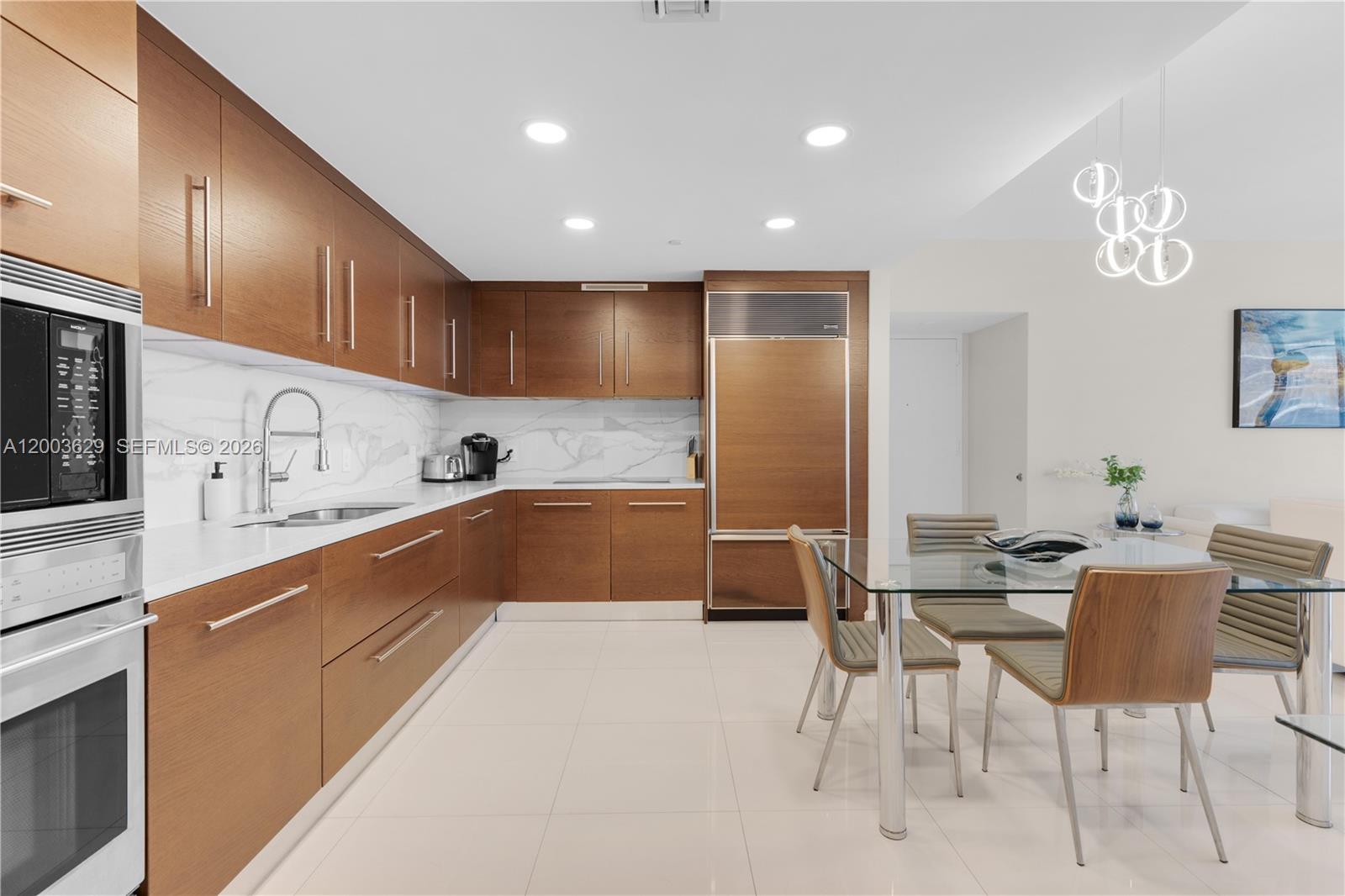 485 Brickell Avenue, Unit 4501 Miami, FL 33131 - Photo 12 of 49 a kitchen with stainless steel appliances granite countertop a sink and cabinets