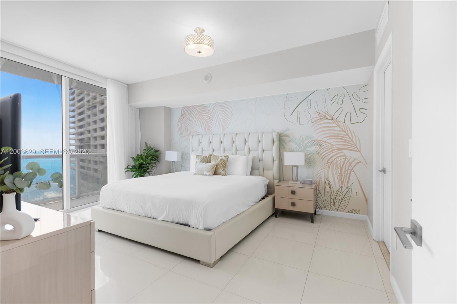485 Brickell Avenue, Unit 4501 Miami, FL 33131 - Photo 13 of 49 a spacious bedroom with a bed and a window