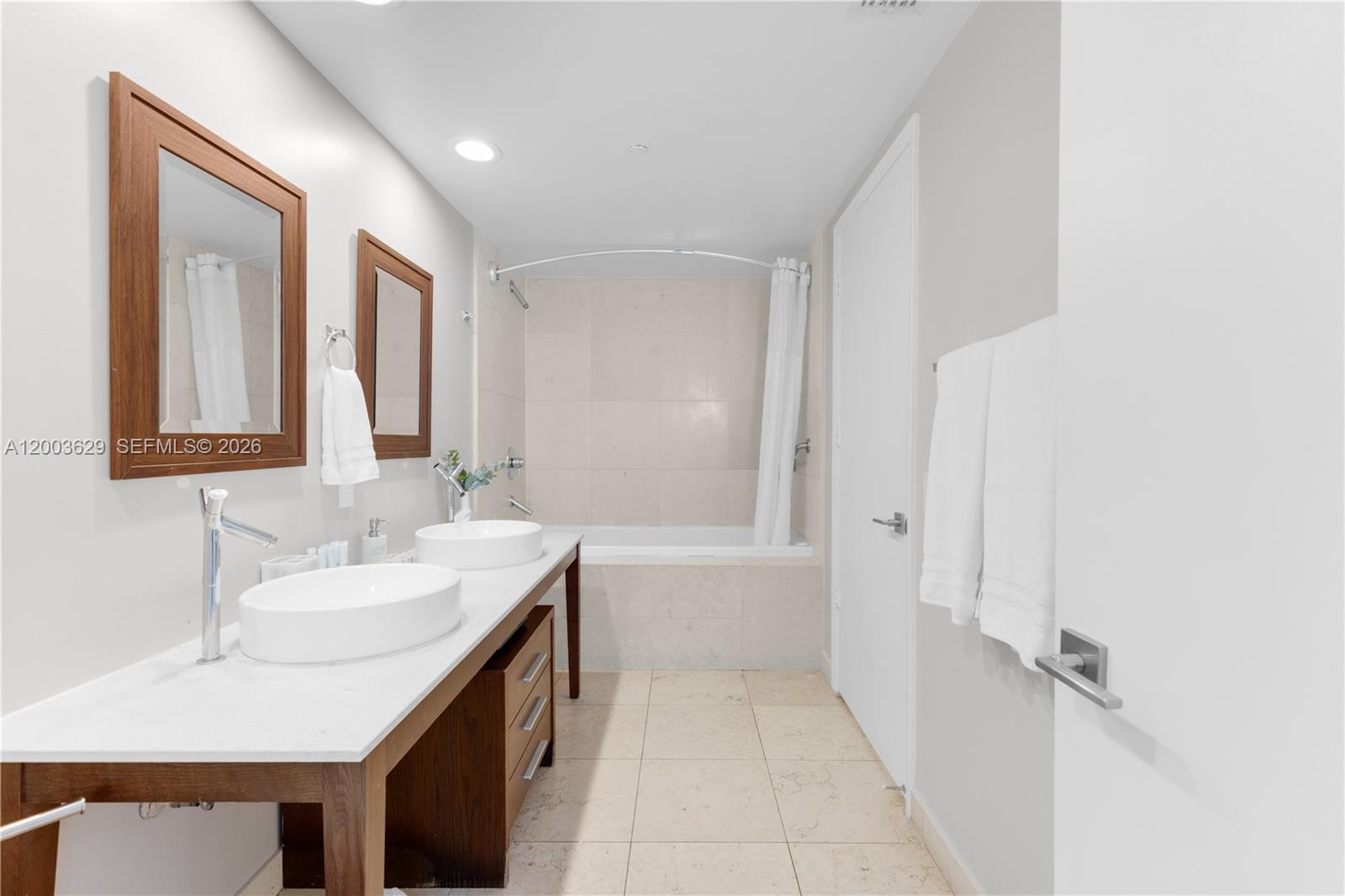 485 Brickell Avenue, Unit 4501 Miami, FL 33131 - Photo 18 of 49 a bathroom with a sink and a mirror
