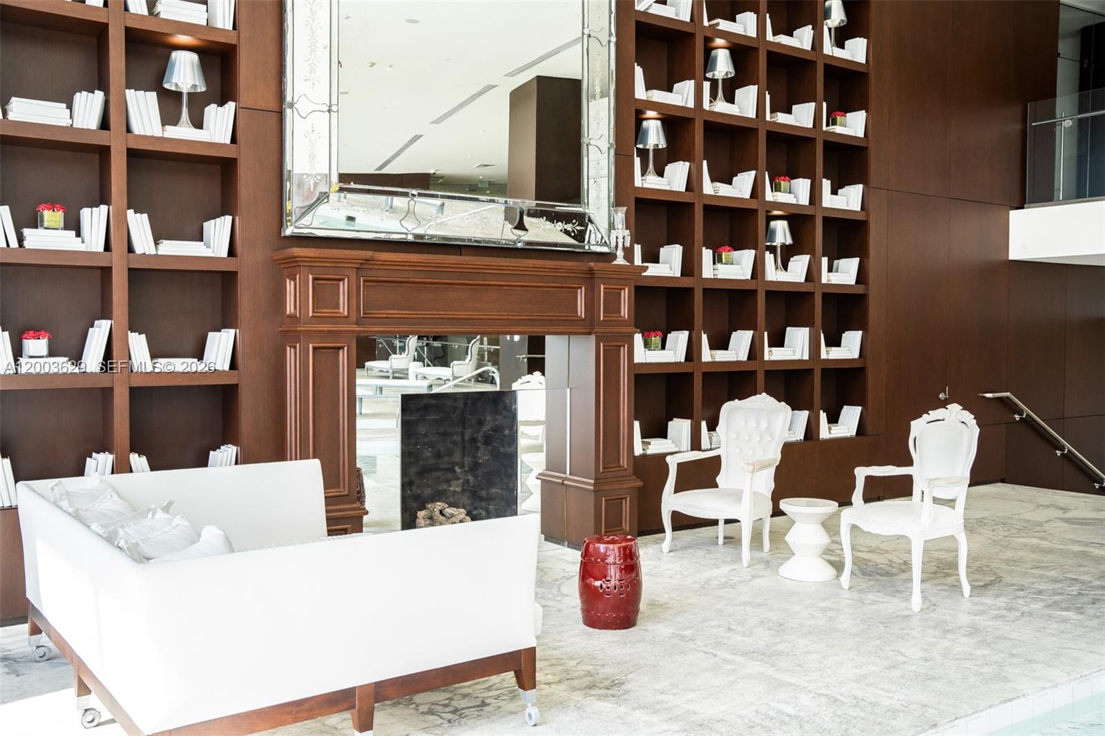 485 Brickell Avenue, Unit 4501 Miami, FL 33131 - Photo 36 of 49 a living room with furniture and a fireplace