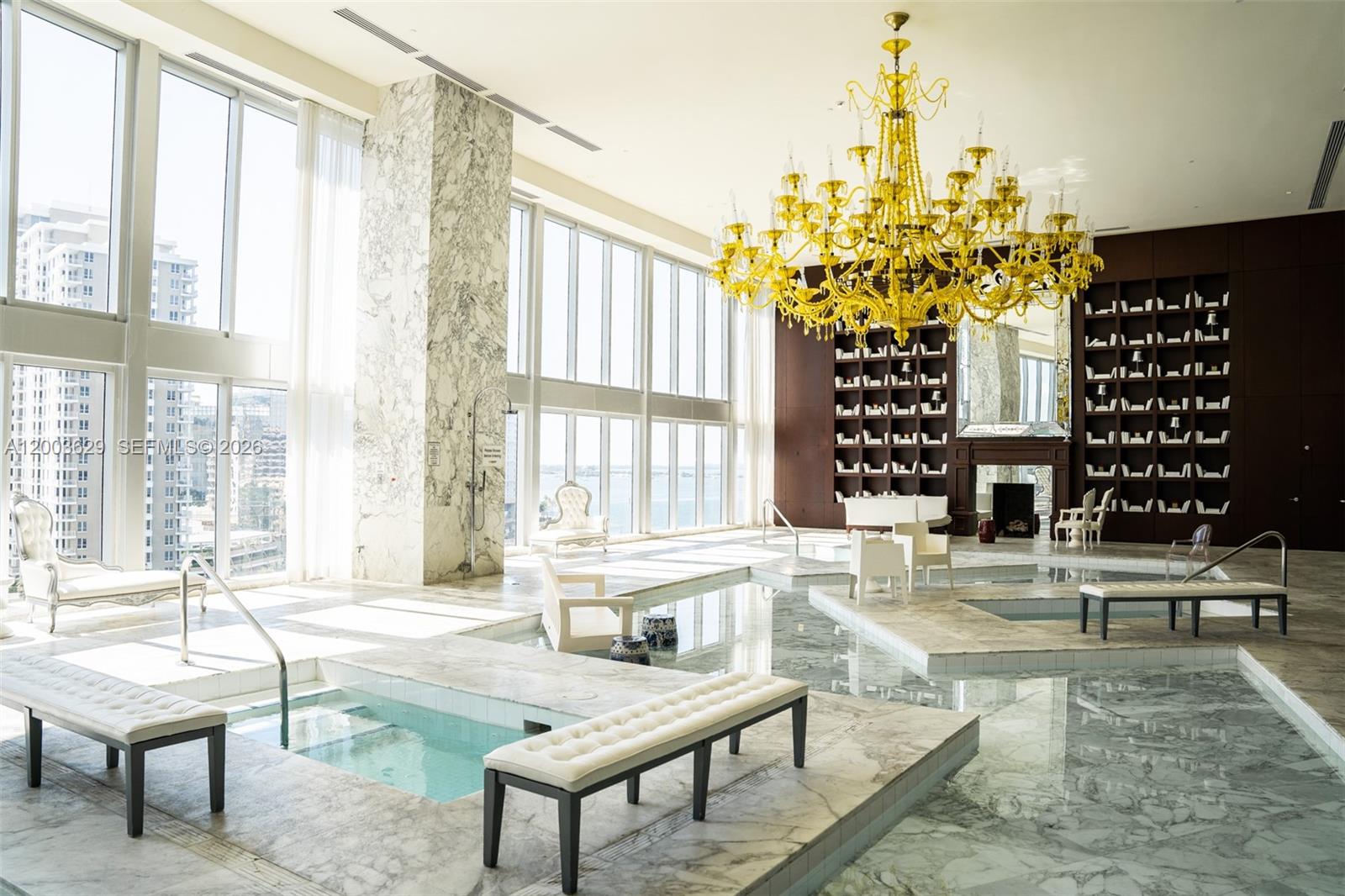 485 Brickell Avenue, Unit 4501 Miami, FL 33131 - Photo 39 of 49 a living room filled with furniture and a chandelier
