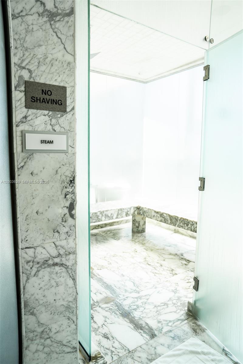 485 Brickell Avenue, Unit 4501 Miami, FL 33131 - Photo 41 of 49 a bathroom with a shower
