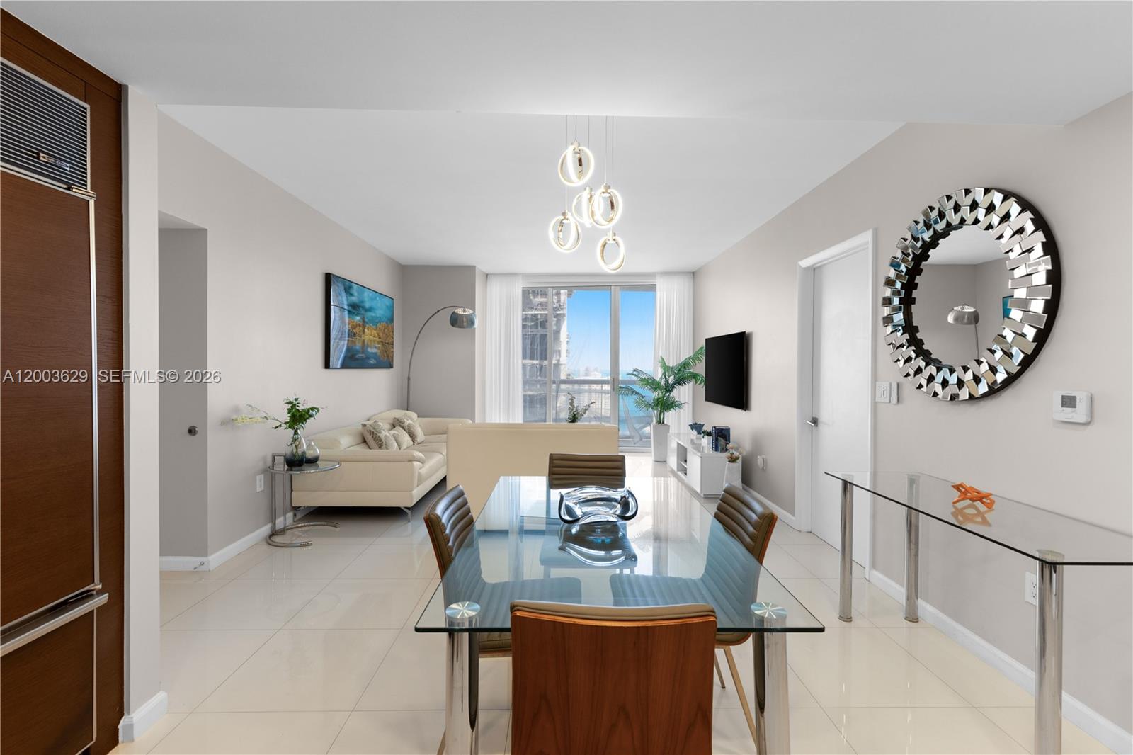 485 Brickell Avenue, Unit 4501 Miami, FL 33131 - Photo 8 of 49 a living room with furniture a fireplace and a window