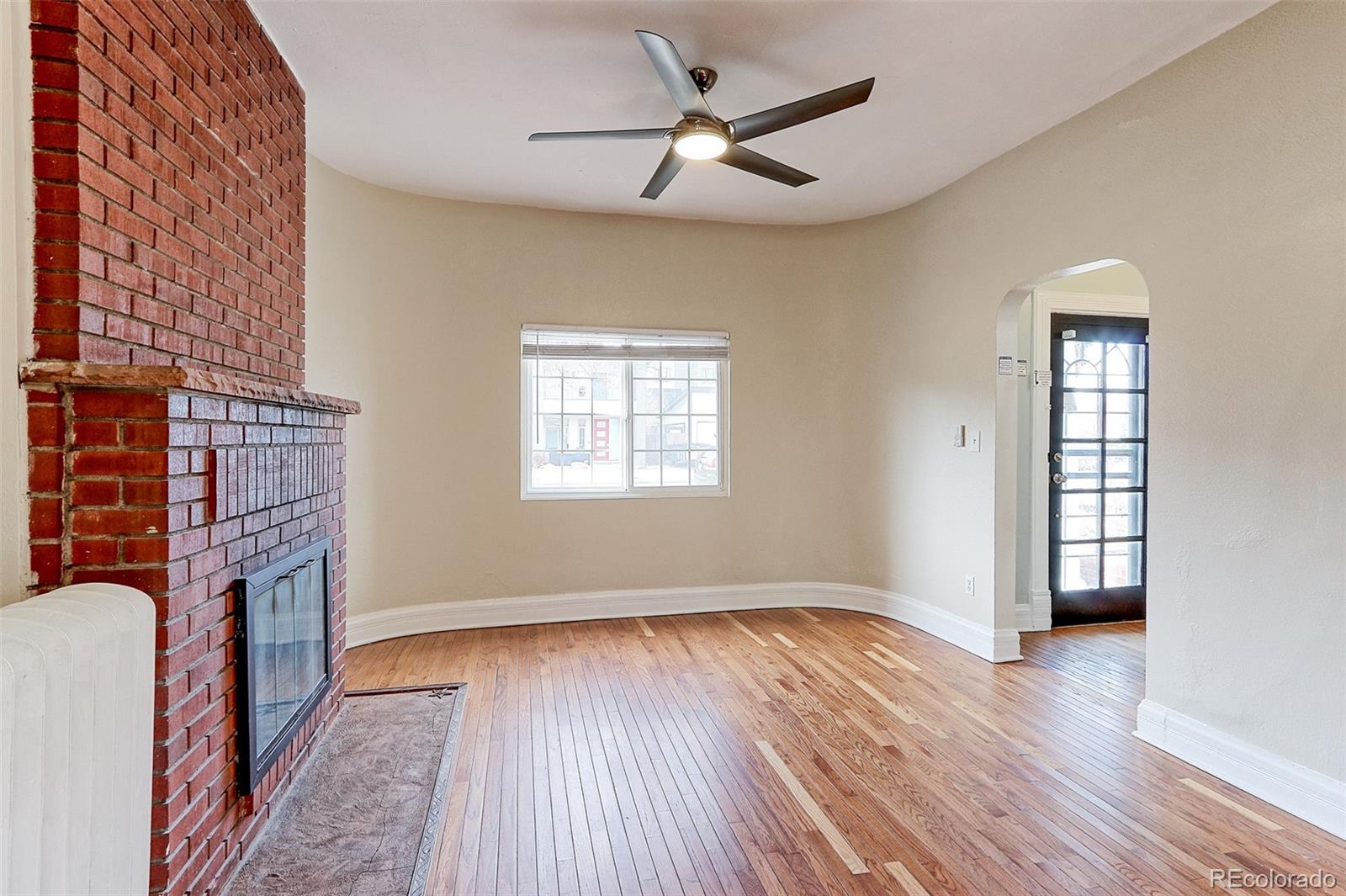 4576 Stuart Street Denver, CO 80212 - Photo 10 of 43 wooden floor in an empty room with a window