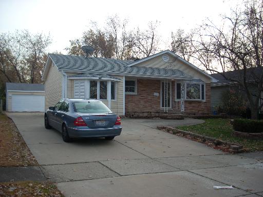 307 East Harrison Road Lombard, IL 60148 - Photo 1 of 16 a car parked in front of a house