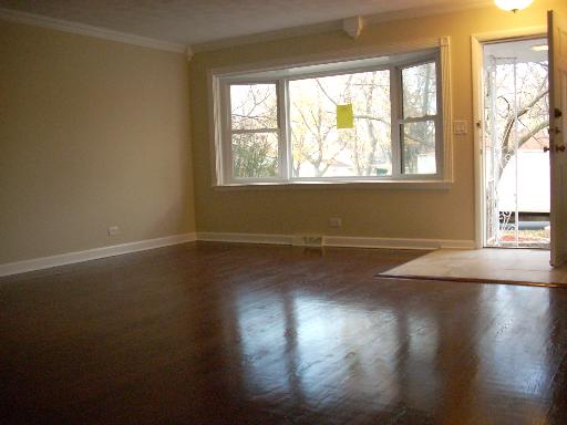307 East Harrison Road Lombard, IL 60148 - Photo 2 of 16 an empty room with wooden floor and windows