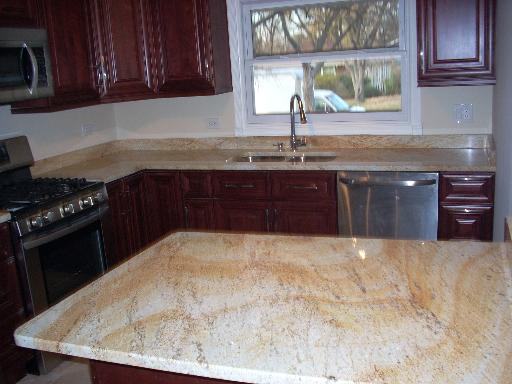 307 East Harrison Road Lombard, IL 60148 - Photo 5 of 16 a kitchen with granite countertop a sink a stove and cabinets