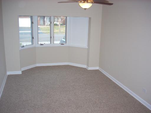 307 East Harrison Road Lombard, IL 60148 - Photo 9 of 16 an empty room with windows