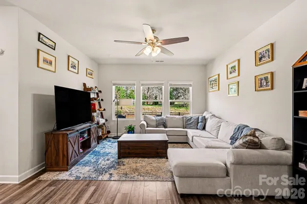 a living room with furniture and a flat screen tv