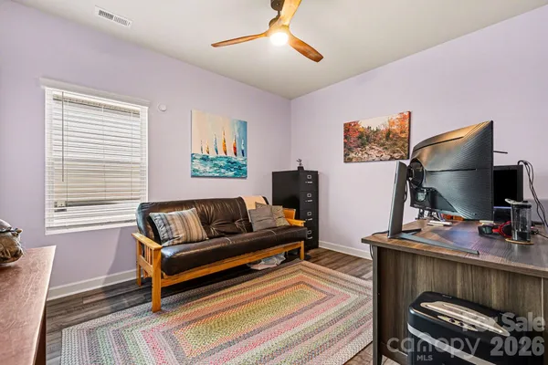 a bedroom with furniture and a window