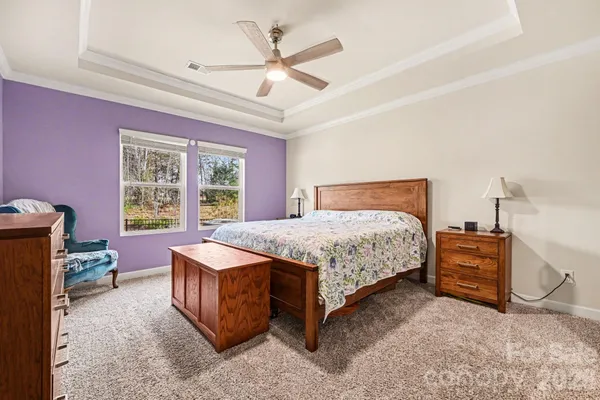 a bed room with a bed and a window