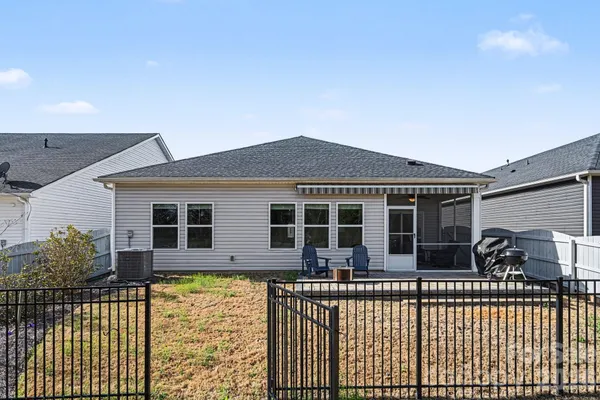 a front view of a house with large windows