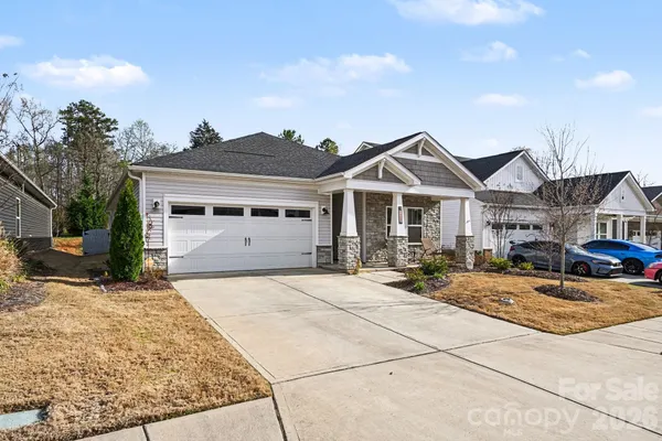 a front view of a house with yard