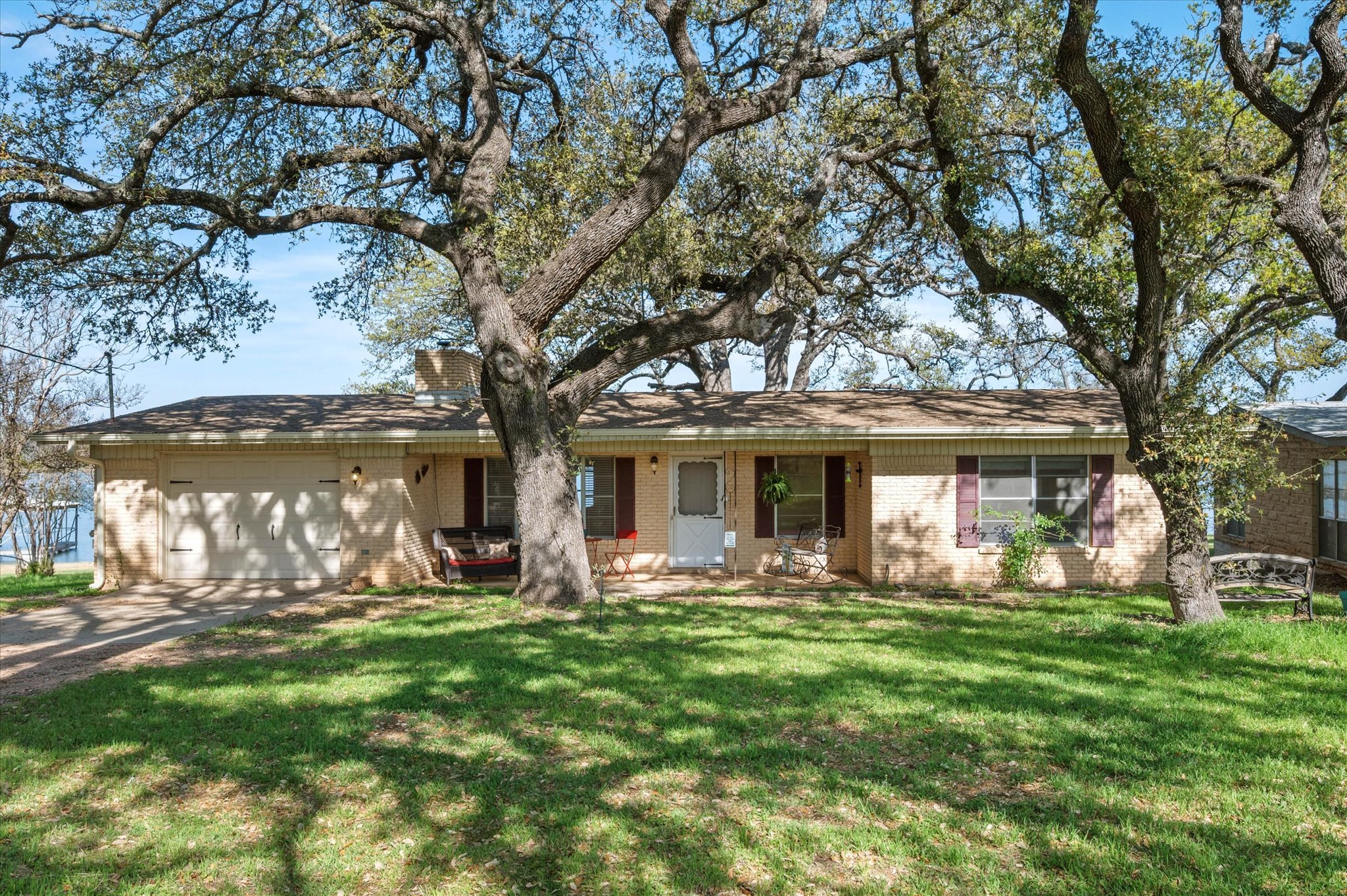 Mid-Century Home, waterfront on Lake Buchanan with garage for your boat or Rv and on a separate track of land on the corner and a attached two car garage.