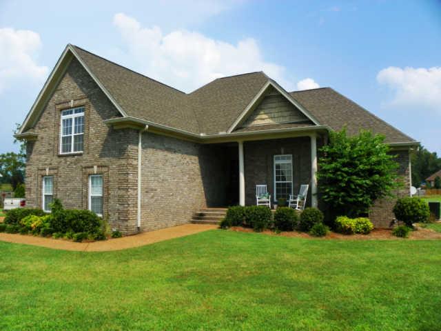 708 Heritage Road Lebanon, TN 37087 - Photo 1 of 15 a front view of a house with a garden