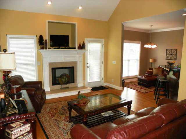 708 Heritage Road Lebanon, TN 37087 - Photo 6 of 15 a living room with furniture a flat screen tv and a fireplace
