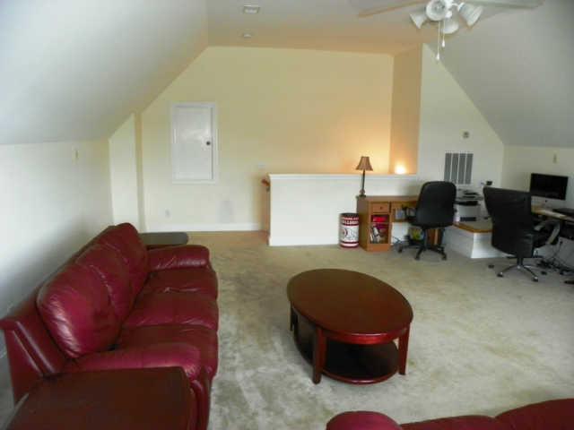 708 Heritage Road Lebanon, TN 37087 - Photo 10 of 15 a living room with furniture and a chandelier