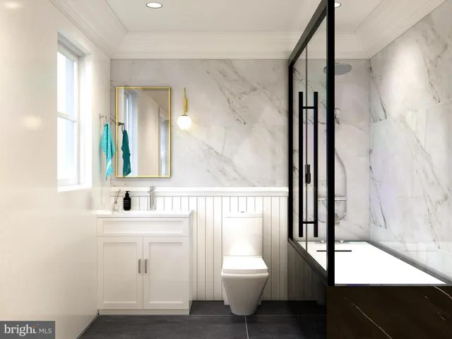 a bathroom with a sink a toilet a mirror and shower