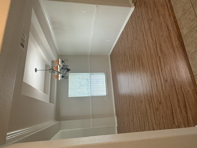 20724 Kearney Hill Road Pflugerville, TX 78660 - Photo 9 of 40 Spacious room featuring wood-finish flooring and a decorative chandelier