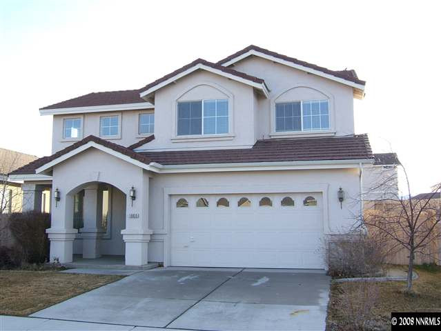 10035 Hampton Park Drive Reno, NV 89521 - Photo 1 of 9 a front view of a house with garden