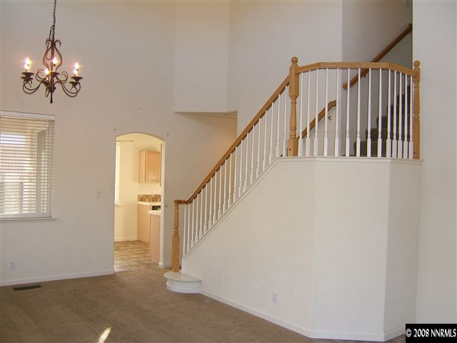 10035 Hampton Park Drive Reno, NV 89521 - Photo 2 of 9 a view of a hallway with windows