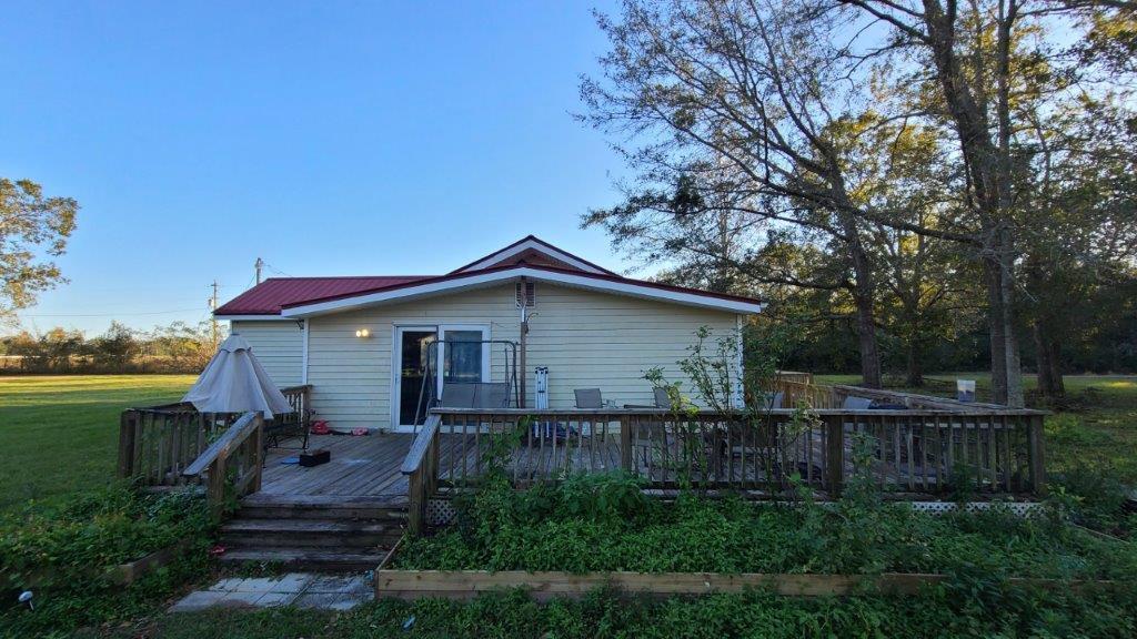 1155 Shady Grove Church Road Baker, FL 32531 - Photo 2 of 113 a small barn in front of a house with wooden fence