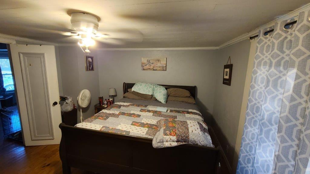 1155 Shady Grove Church Road Baker, FL 32531 - Photo 31 of 113 a bed sitting in a bedroom next to a window and a mirror