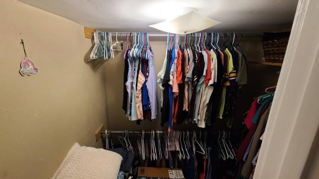 1155 Shady Grove Church Road Baker, FL 32531 - Photo 35 of 113 a view of walk in closet with clothes