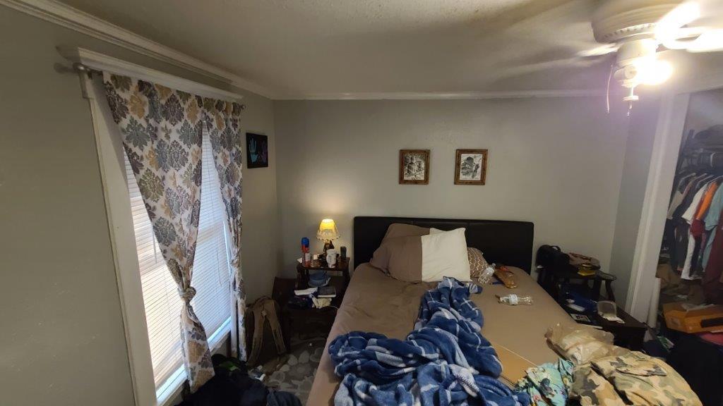 1155 Shady Grove Church Road Baker, FL 32531 - Photo 42 of 113 a bed sitting in a bedroom next to a window and a lamp