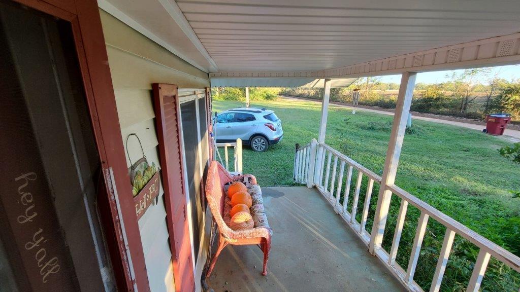 1155 Shady Grove Church Road Baker, FL 32531 - Photo 51 of 113 a view of a porch with wooden floor and stairs