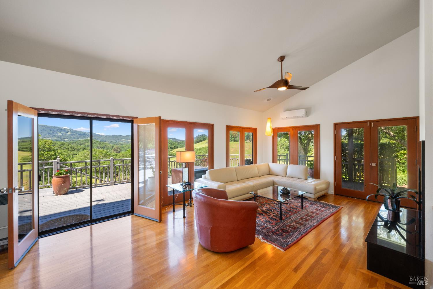 10601 Slattery Road Glen Ellen, CA 95442 - Photo 7 of 45 Banks of windows and glass doors bring in the outdoors; vaulted ceilings enhance the volume.
