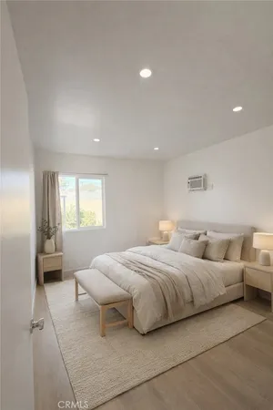 a bedroom with bed and window