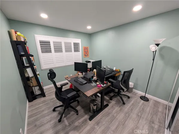 a workspace with furniture and wooden floor