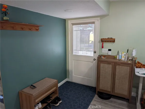 a room with a window and flowerpot