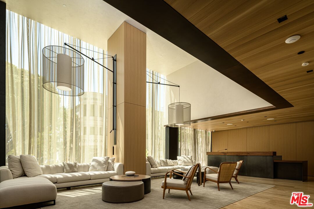 8899 Beverly Boulevard, Unit 6G Los Angeles, CA 90048 - Photo 2 of 25 a living room with furniture and a large window