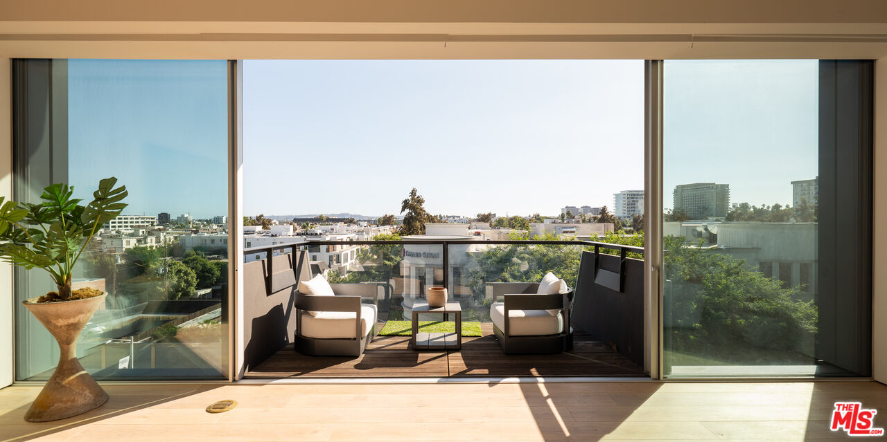 8899 Beverly Boulevard, Unit 6G Los Angeles, CA 90048 - Photo 6 of 25 a view of a balcony with wooden floor