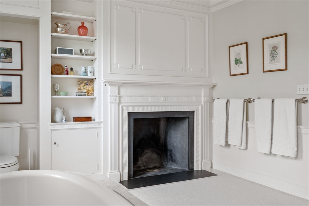 427 Concord Road Sudbury, MA 01776 - Photo 26 of 42 a living room with furniture and a fireplace