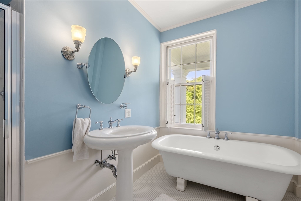 427 Concord Road Sudbury, MA 01776 - Photo 28 of 42 a bathroom with a sink and a mirror