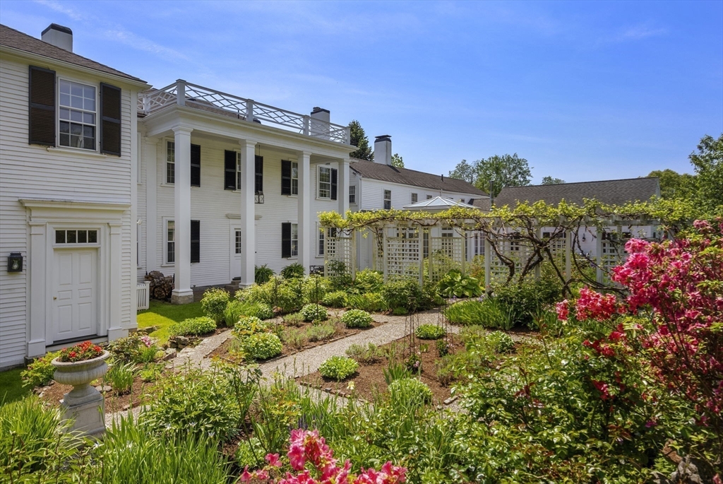 427 Concord Road Sudbury, MA 01776 - Photo 34 of 42 a front view of a house with a yard