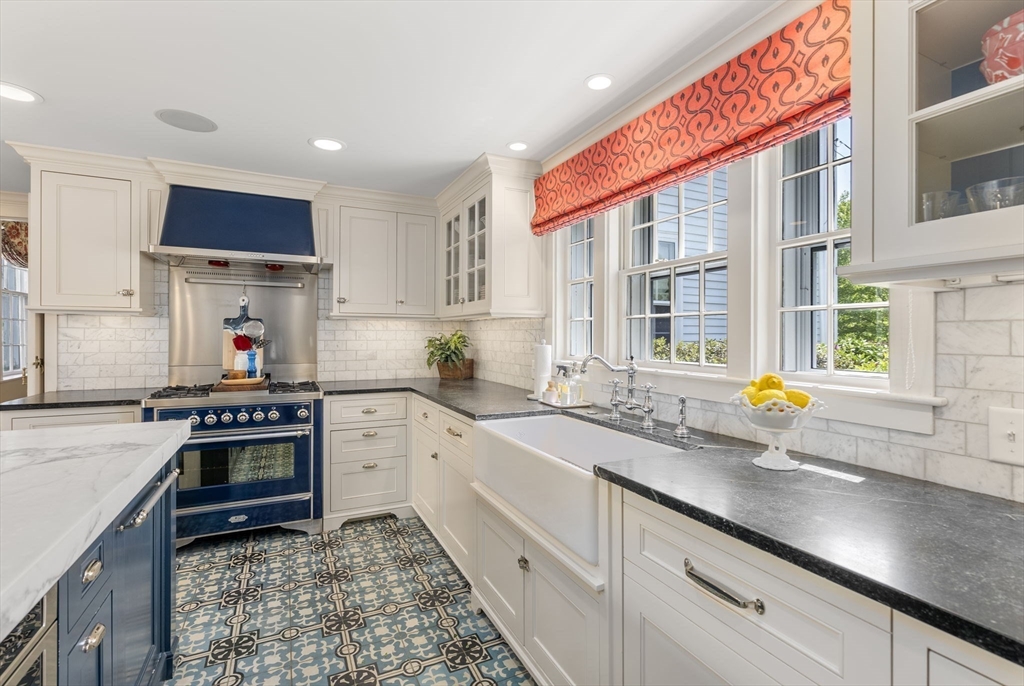 427 Concord Road Sudbury, MA 01776 - Photo 5 of 42 a kitchen with stainless steel appliances granite countertop a stove a sink and a granite counter tops with white cabinets