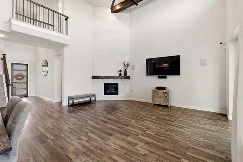 a view of livingroom with hardwood floor and a flat screen tv