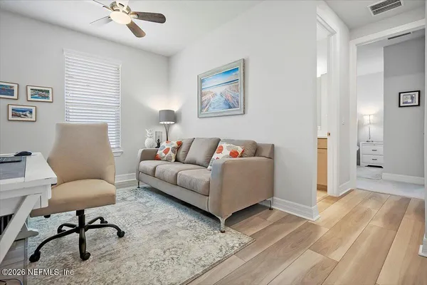 a living room with furniture and a rug
