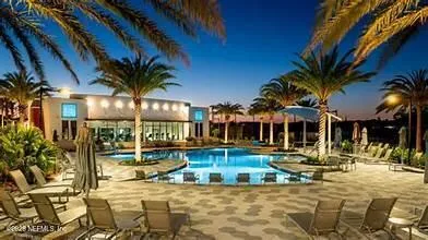 a view of a swimming pool with a patio