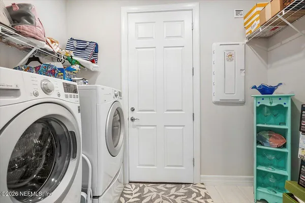 a utility room with dryer and washer